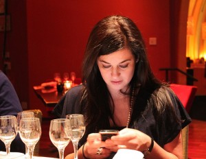 woman on a smartphone in restaurant